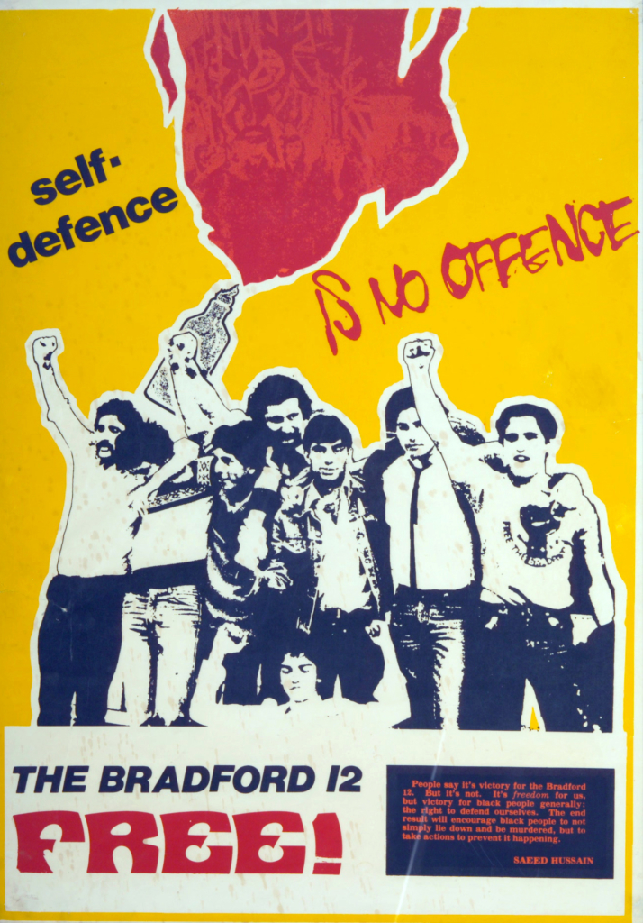 The Free the Bradford 12 poster. It has a bright yellow background at the bottom it reads 'The Bradford 12 FREE!". Above this, a reproduced cut out photography of a group of men is celebrating. Above this, it reads "self-defence is no offence"